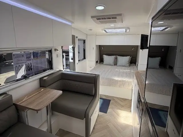 Café dinette, bed and TV inside the Ranger 174MD-1